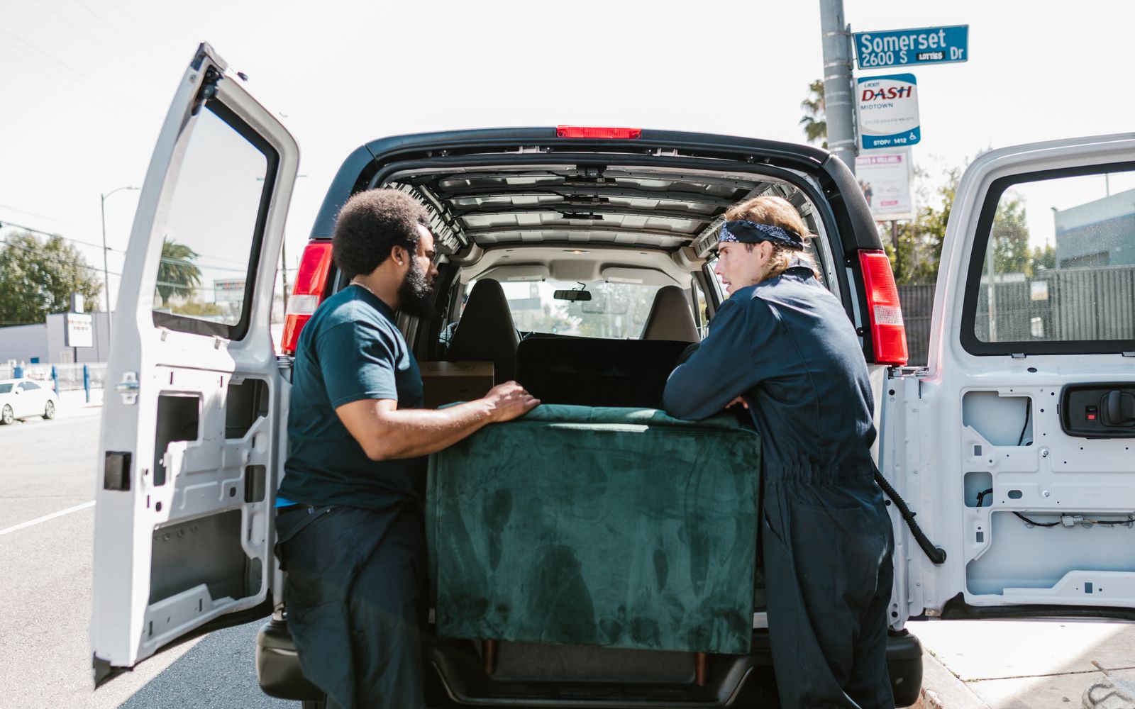 Grizzly Junk Solutions crew loading furniture into the truck