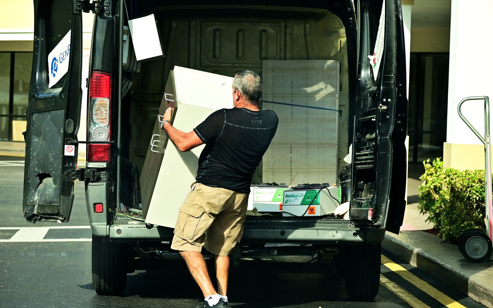 Crew loading old furniture onto the Grizzly truck
